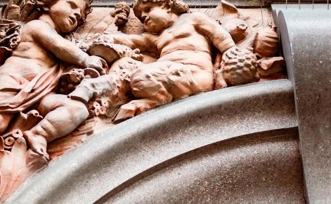 a statue of two men on the side of a building at Grey Street Hotel in Newcastle upon Tyne